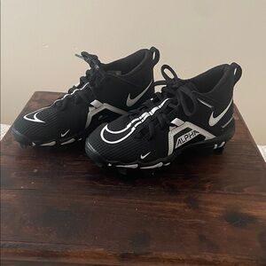Nike Alpha Black and White Sports Cleats
